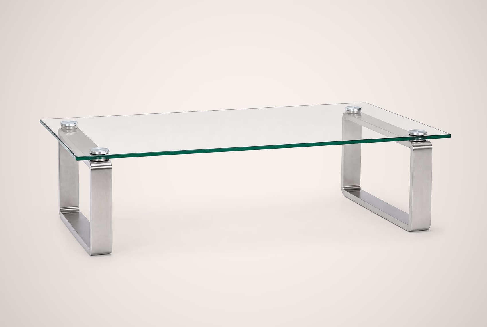 Glass-topped coffee table on brushed steel legs, on a white background.