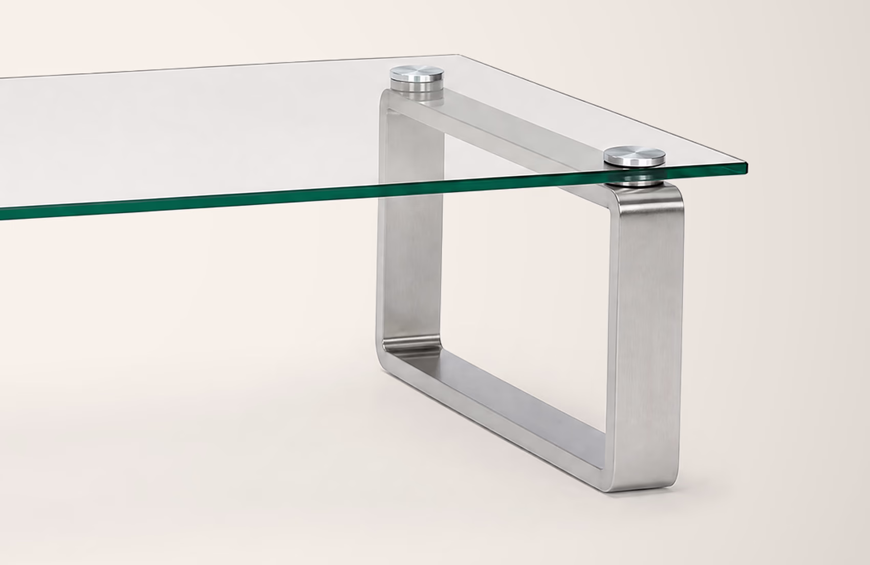 Detail of the glass edge and chrome mounting disc in the original photograph.
